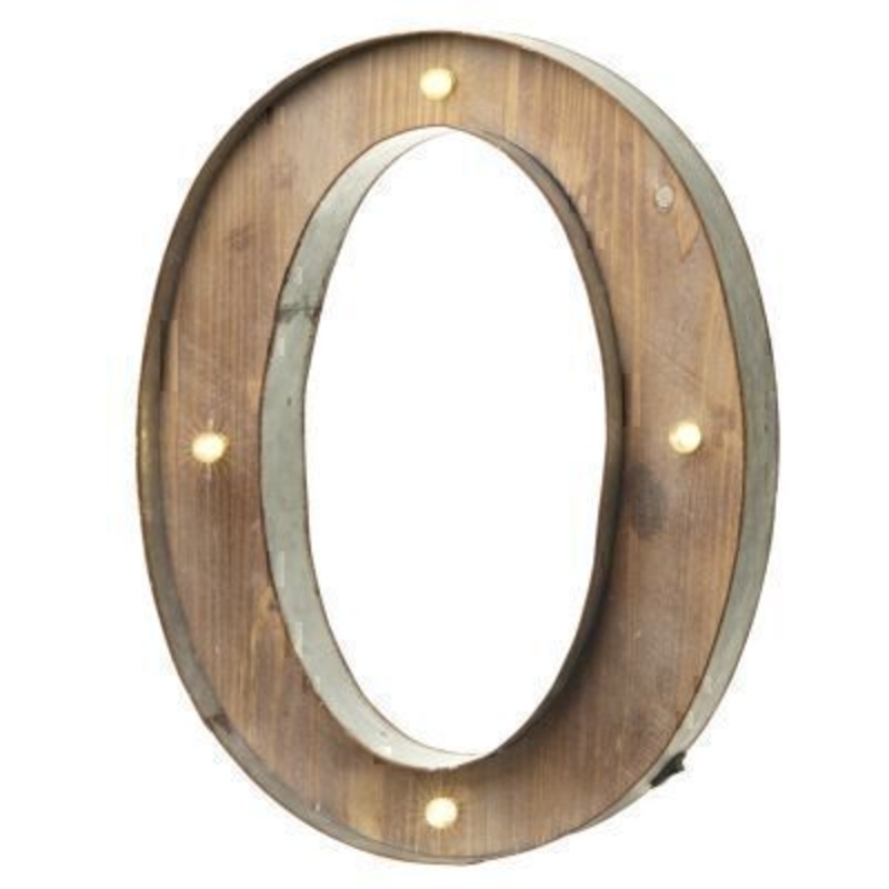 This O Sign With LED Lights by Heaven Sends could be paired with other letters to create a bespoke initial sign for a couple or to be displayed on its own. Large in size this M sign has got LED lights and a switch on the side to turn it on. Made from wood and metal. Size: 41x5x41cm
